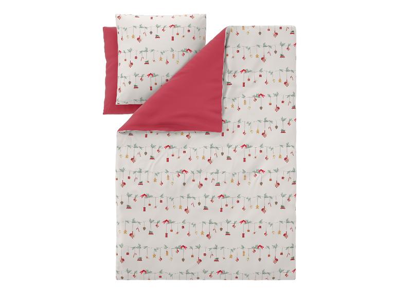 Parure de lit de Noël avec motifs festifs et taie d'oreiller assortie.