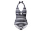 Un maillot de bain une pièce à rayures noires et blanches avec un décolleté halter.