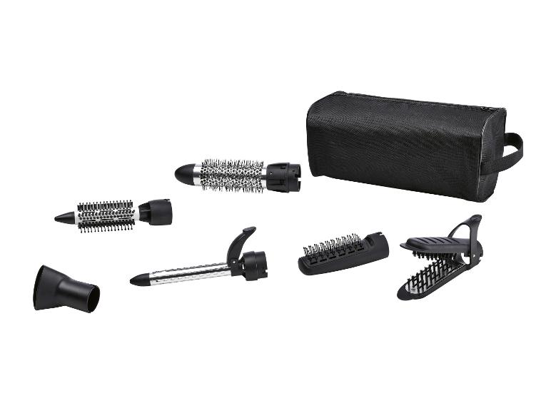 Kit de coiffure avec brosses rotatives, accessoires et étui.