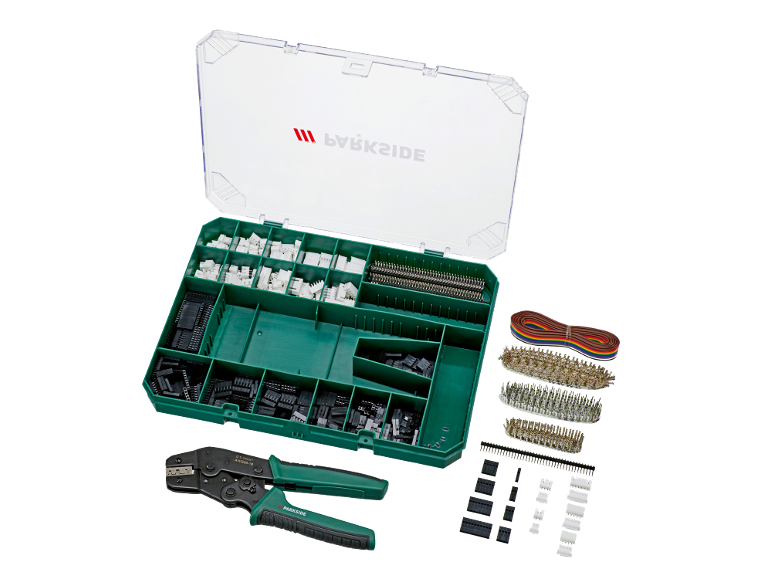 Un kit d'outils de sertissage avec divers connecteurs, broches et fils dans une boîte de rangement.