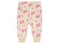 Pantalon de jogging blanc avec imprimé rose d'arbres et de cœurs.