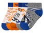 Trois paires de chaussettes avec des motifs différents.