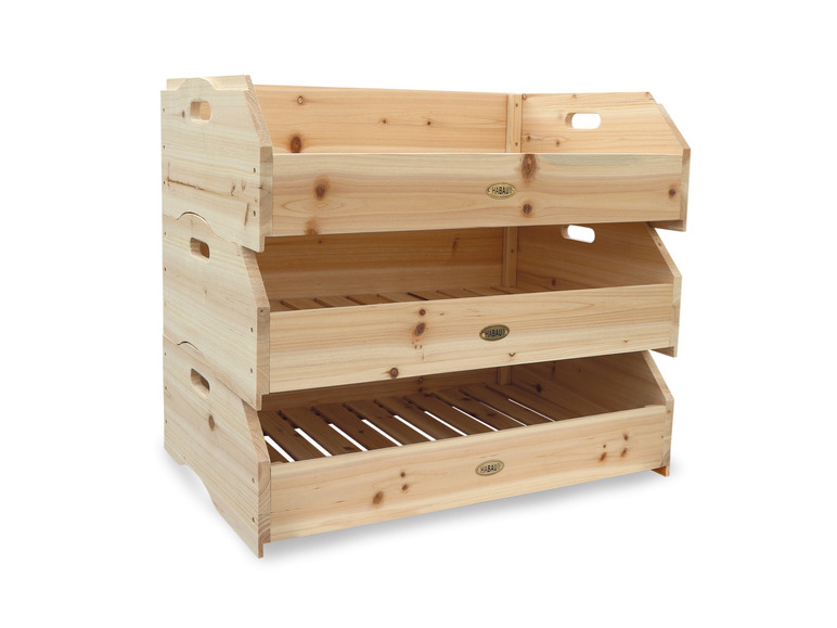 Trois boîtes de rangement en bois Habau empilées les unes sur les autres.