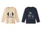 Deux t-shirts manches longues pour enfants : un beige avec un chien et le texte 'Meilleur ami', et un bleu marine avec un tracteur et le texte 'Aventure en tracteur'.