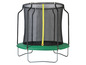 Un trampoline rond avec un filet de sécurité et une surface de saut verte.