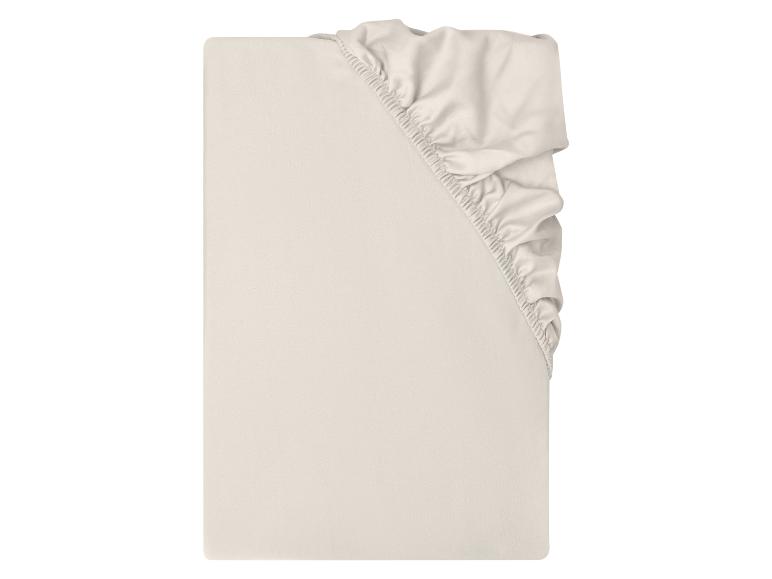 Drap-housse beige avec coins élastiques
