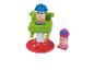 Ensemble de jouets avec un fauteuil de barbier et deux figurines aux cheveux modelables.