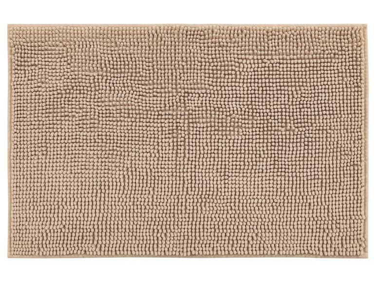 Un tapis de bain beige avec une texture moelleuse.