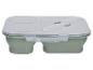 Boîte à lunch pliable verte avec couvercle transparent et couverts intégrés.