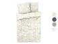 Parure de lit beige avec un motif floral blanc