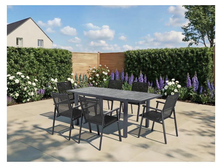 Ensemble de mobilier de jardin avec table grise et six chaises sur une terrasse.