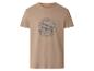 T-shirt beige avec un motif d'avion gris et le texte 'ADVENTURE TIME BORN TO FLY'.