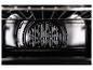 Intérieur du four avec ventilateur à convection visible et grille.