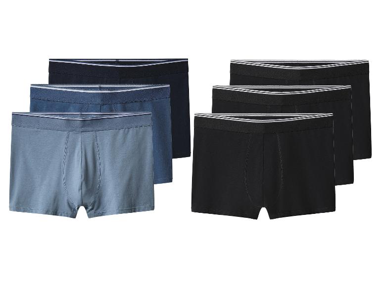 Six paires de boxers pour hommes, trois bleus et trois noirs.