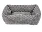Lit gris et doux pour animaux de compagnie en tissu texturé.