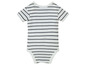 Un body bébé blanc à rayures noires.