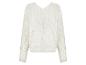 Pull en maille crème à motif ajouré.
