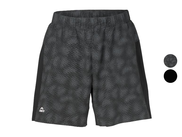 Short de sport gris foncé avec motif subtil et empiècements latéraux noirs.