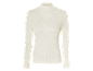Pull blanc à col roulé en côtes.