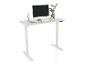 Bureau blanc réglable en hauteur avec ordinateur, plante et main en bois.