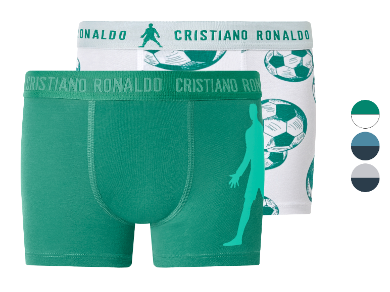 Boxers pour hommes avec imprimé de ballons de football et silhouette de footballeur, verts et blancs.