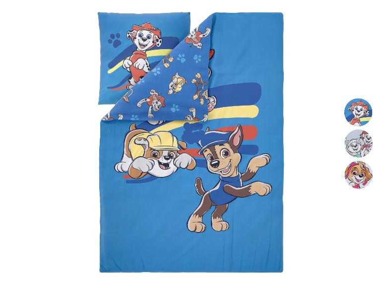 Parure de lit bleue avec housse de couette et taie d'oreiller à motifs de chiots de dessins animés.
