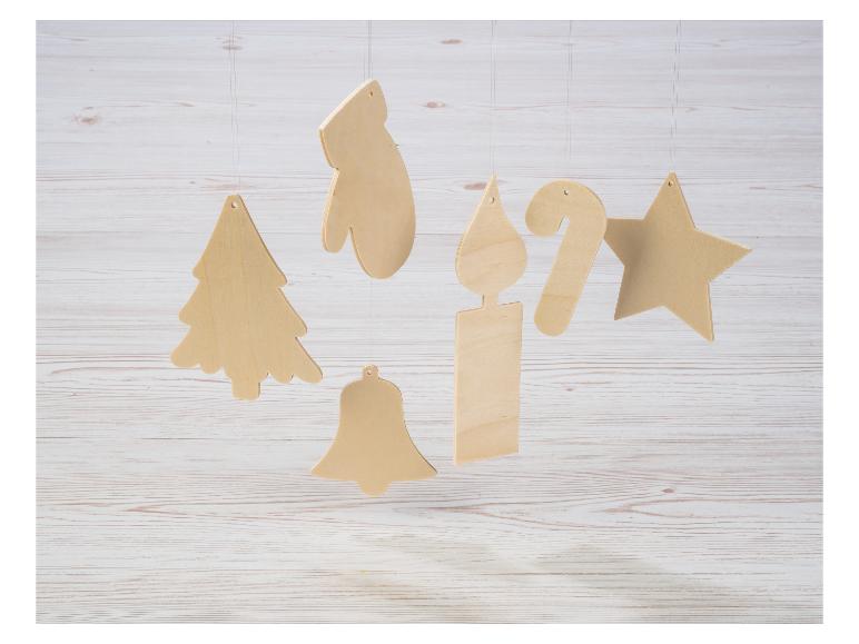 Décorations de Noël en bois: sapin, moufle, bougie, canne à sucre, étoile, cloche.