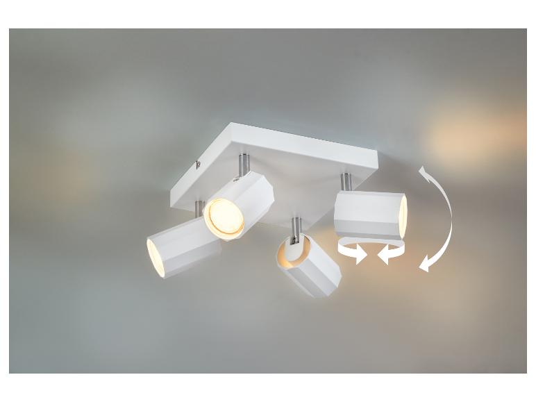 Luminaire de plafond moderne à quatre spots orientables.