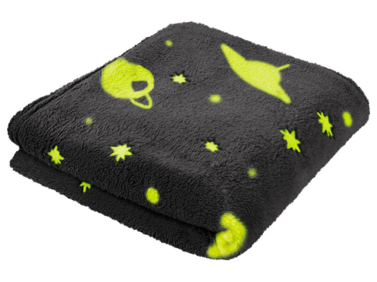 Couverture en peluche gris foncé avec des motifs spatiaux jaune néon.