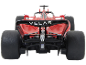 Vue arrière d'une voiture de course miniature rouge avec pneus noirs et aileron.