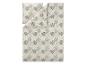 Parure de lit avec motif feuilles de palmier dans les tons beige et vert.
