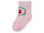 Une chaussette rose avec une fleur et l'inscription 'I love the world'.