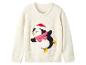 Pull blanc avec un pingouin patinant, portant un bonnet de Père Noël et une écharpe rose