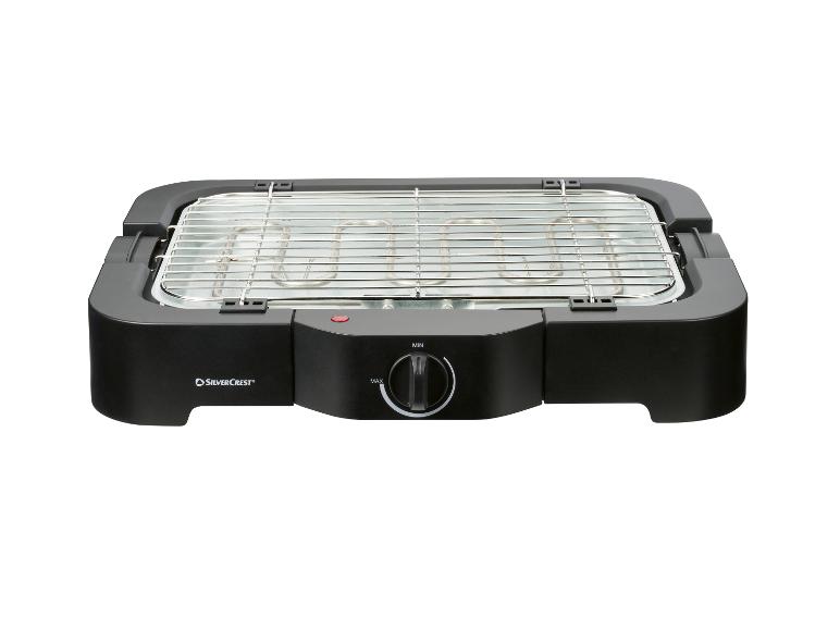 Gril électrique noir avec grille métallique et bouton de réglage de la température