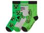 Trois paires de chaussettes avec des motifs de personnages pixelisés, en vert et gris.