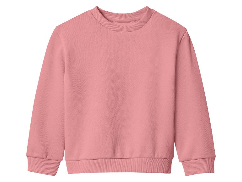 Un sweat-shirt rose uni à manches longues et col rond.