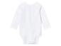 Un body blanc à manches longues pour bébé.