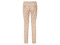 Pantalon beige à motif de feuilles blanches
