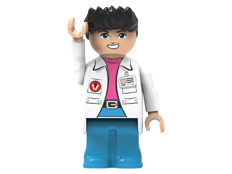 Une figurine Lego d'un homme aux cheveux noirs, lunettes, blouse de laboratoire et pantalon bleu.