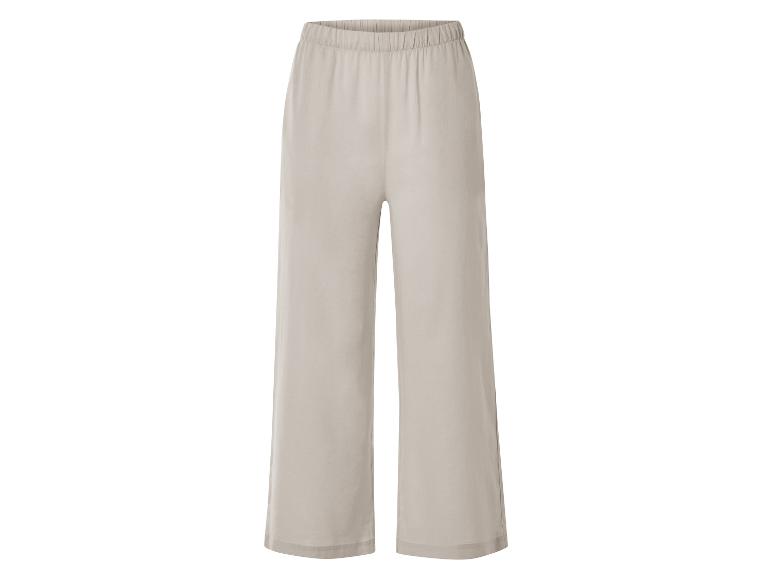 Pantalon large beige élégant.