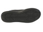 La semelle d'une chaussure de sport noire avec un motif ondulé.