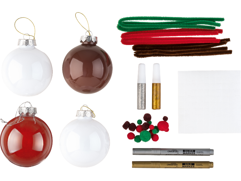 Kit de bricolage de Noël avec boules, chenilles, paillettes, pompons et marqueurs.