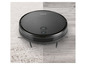 Un aspirateur robot Silvercrest noir sur un tapis.