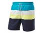 Shorts de bain multicolores : bleu turquoise, blanc et jaune pâle.