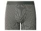 Caleçon boxer homme à rayures verticales blanches sur fond gris foncé.