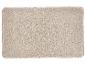Tapis de bain beige avec motif en relief