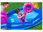 Piscine gonflable, toboggan et anneau de jeu dinosaure pour enfants.