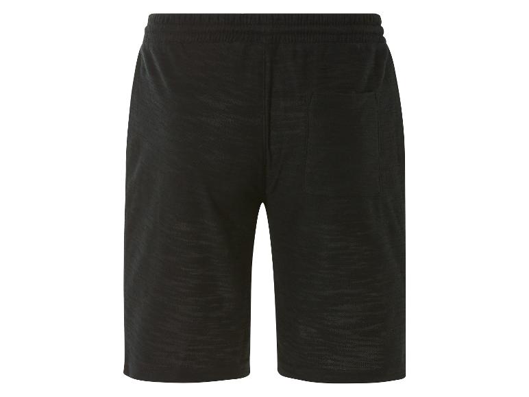 Pantalon de survêtement noir avec cordon de serrage.