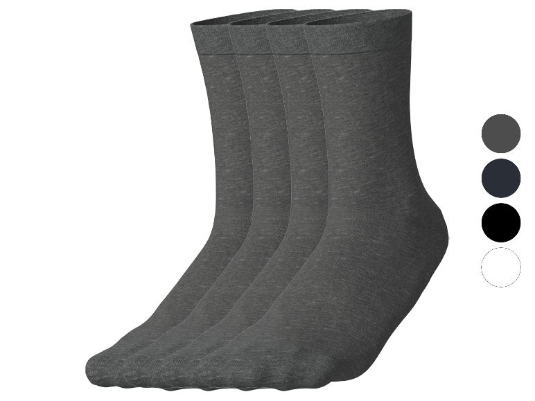Quatre paires de chaussettes grises avec des échantillons de couleurs gris, bleu foncé, noir et blanc