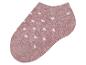 Chaussette rose à pois blancs.